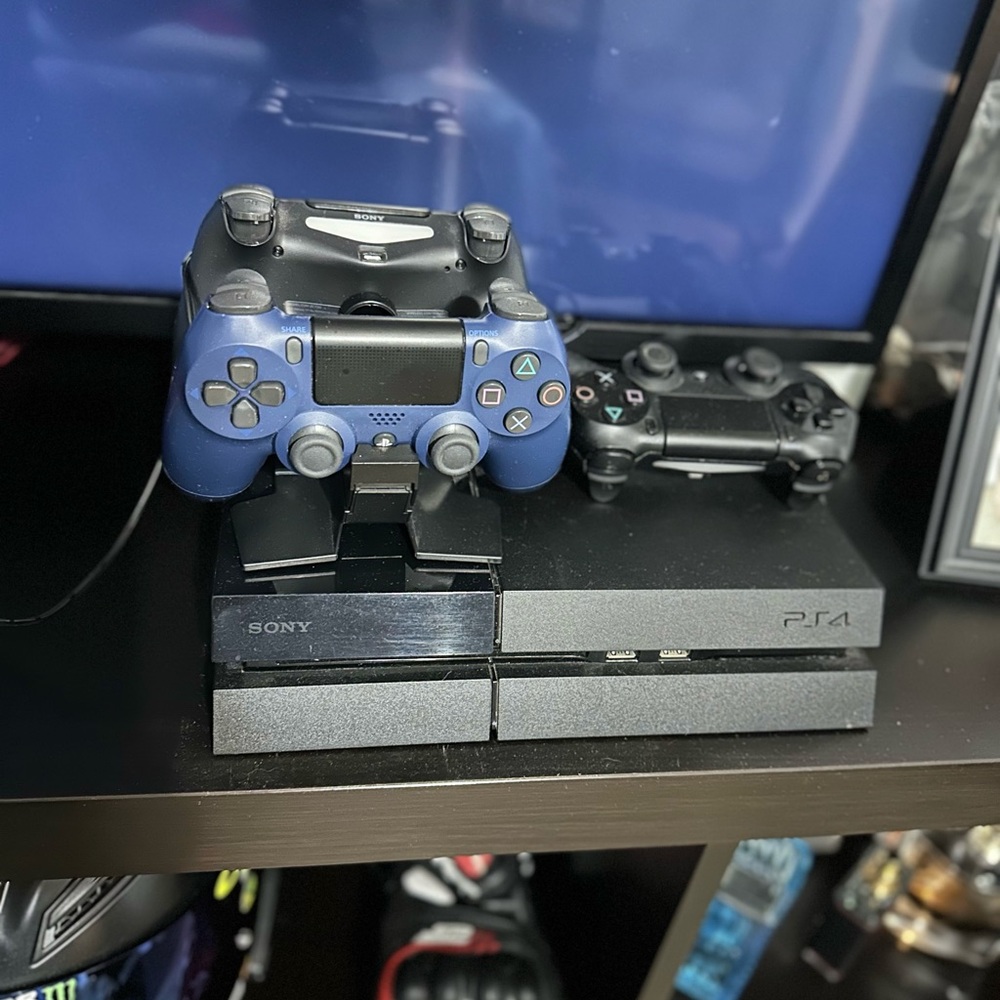 Sony PS4 Console with Black and Blue Controllers